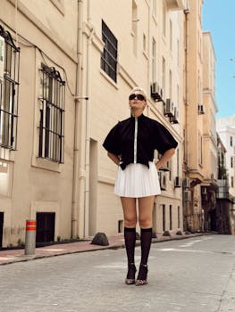 Fashionable woman in chic urban outfit posing on a street in İstanbul, Türkiye.