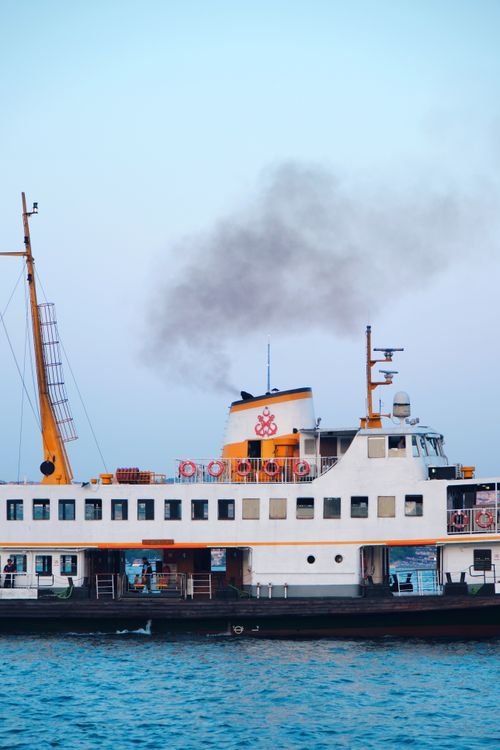 Free A classic ferry boat cruising the Bosphorus at sunset, Istanbul, Türkiye. Stock Photo