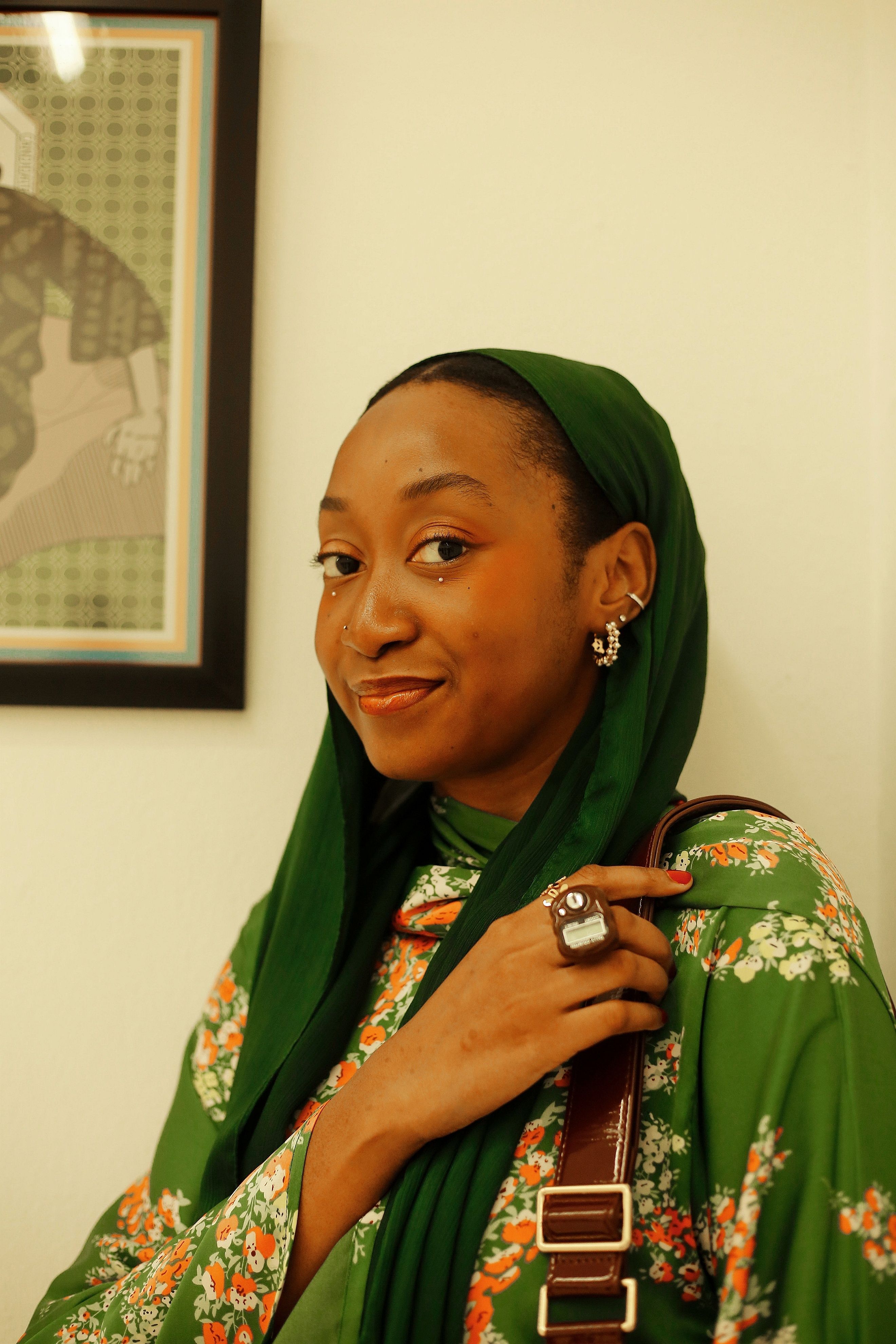 Portrait of Woman in Green Hijab with Floral Attire · Free Stock Photo