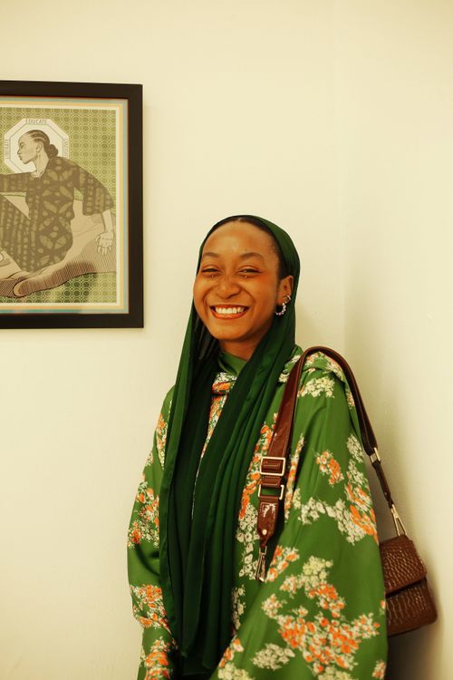Smiling Woman in Green Hijab with Artwork Background · Free Stock Photo