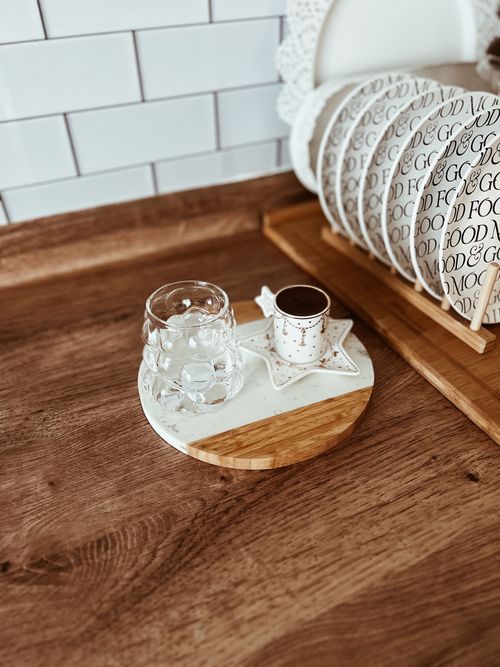 Free Cozy kitchen counter with coffee cup and glass in rustic setting. Stock Photo