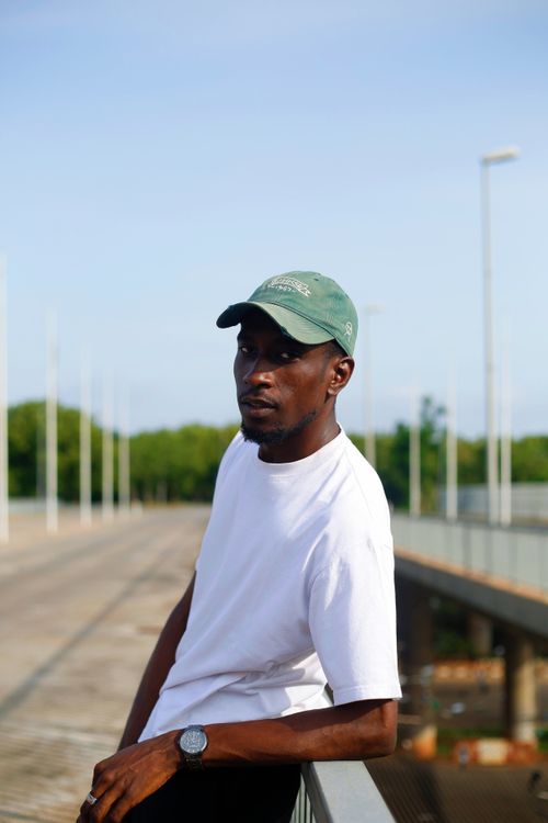 Free Portrait of a man in casual attire on a bridge in Abuja, Nigeria. Stock Photo