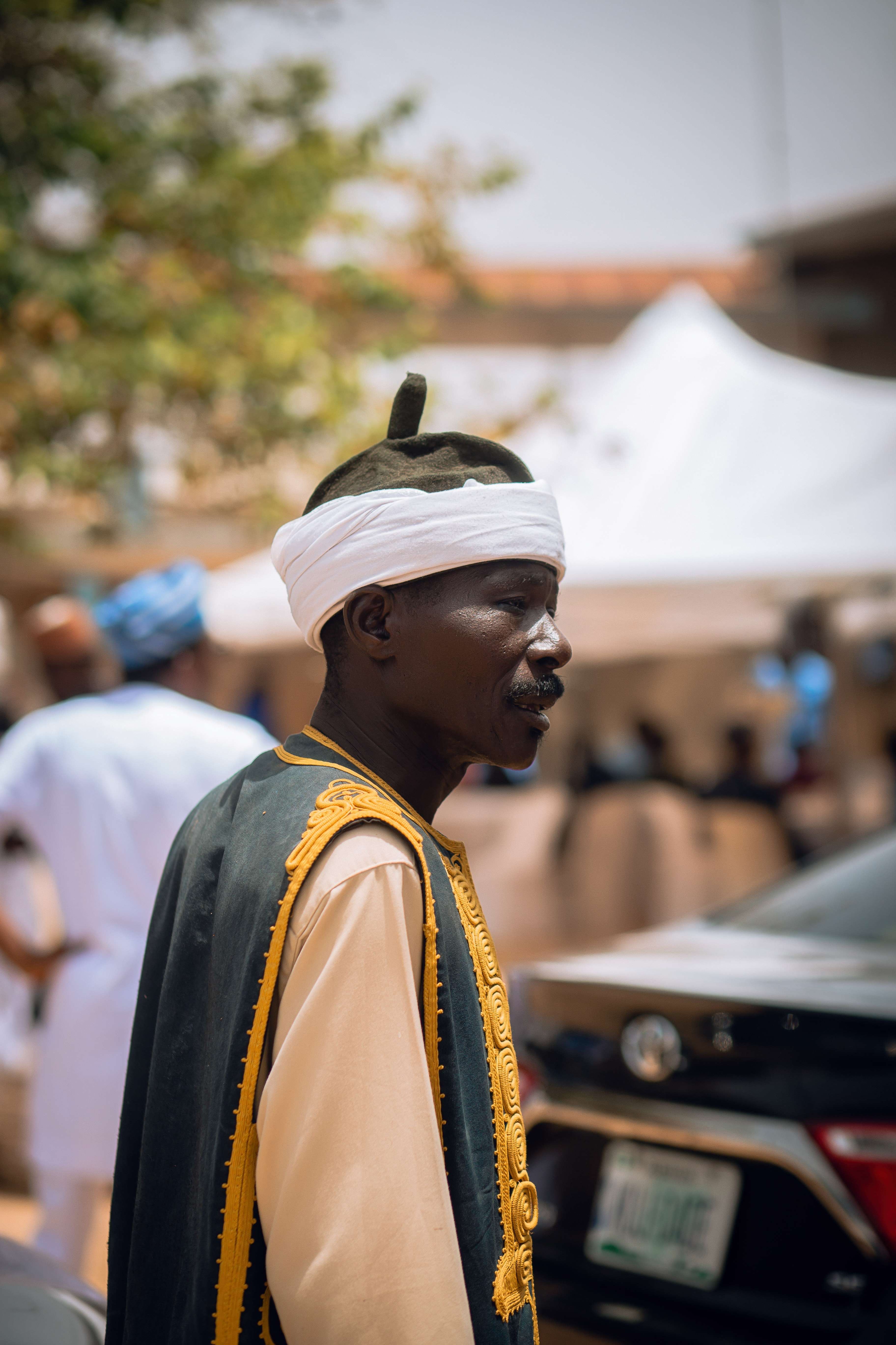 Man in Traditional Attire at Outdoor Event · Free Stock Photo