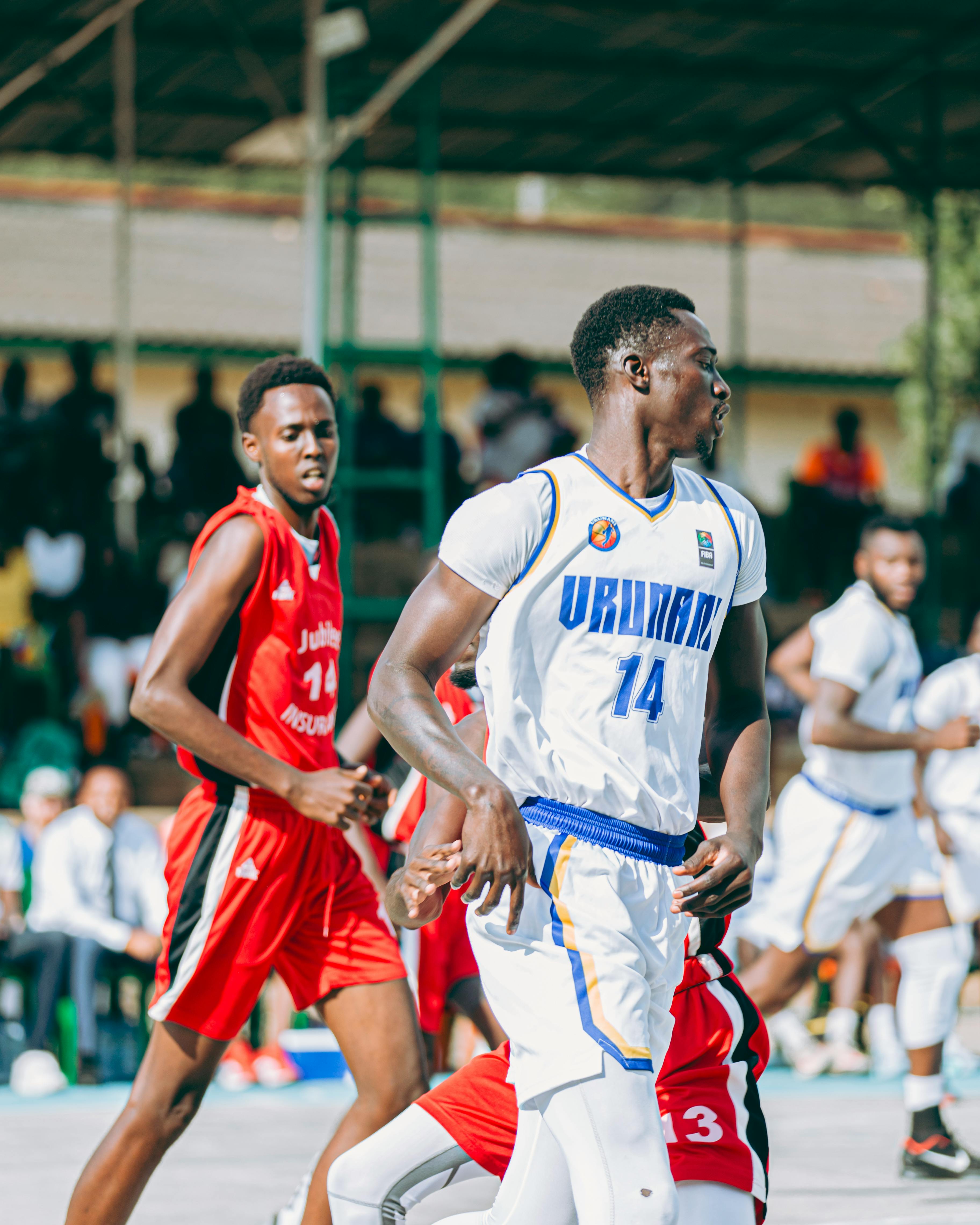 Intense outdoor basketball game with players in action showcasing team spirit and athleticism.