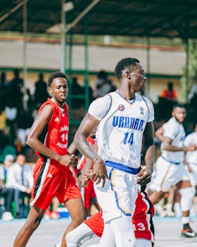 Intense outdoor basketball game with players in action showcasing team spirit and athleticism.