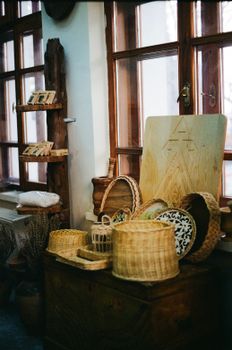 Cozy indoor setting featuring rustic artisan baskets and wooden decor on display.