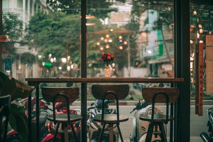 Brown Bar Stools In Front Of Rectangular Table