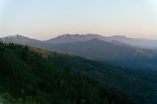 Free Marvel at the serene vistas of the Wasatch Mountains in Utah, captured at sunset in summer. Stock Photo