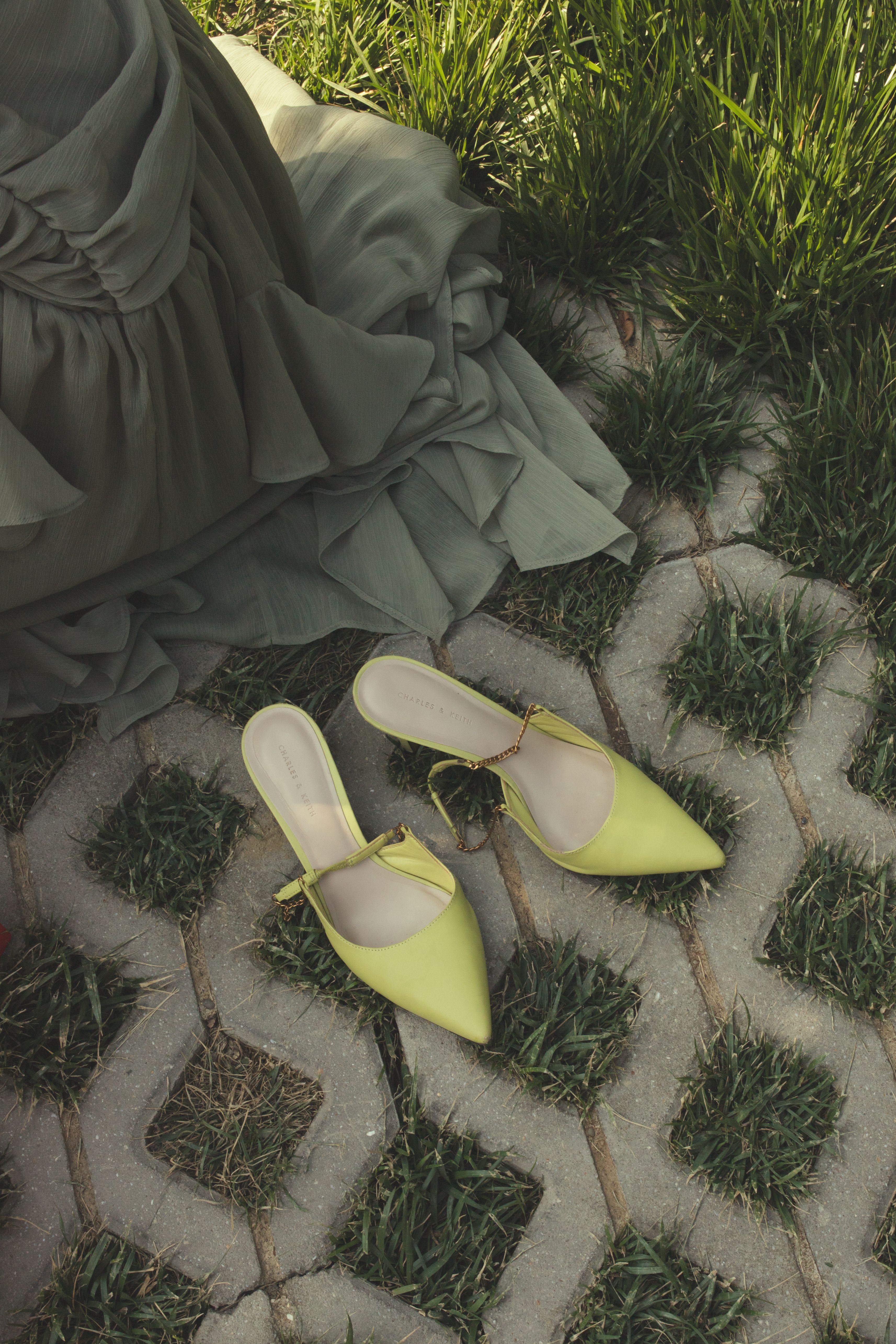 Woman in Black Dress Holding Green High Heels Free Stock Photo Woman in Black Dress Holding Green High Heels Free Stock Photo