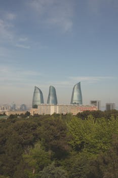 Baku's Flame Towers stand majestically against a clear sky, showcasing Azerbaijan's iconic architecture.