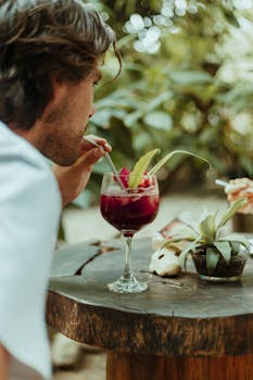 Enjoying a vibrant cocktail in the lush outdoors of Palomino, Colombia.