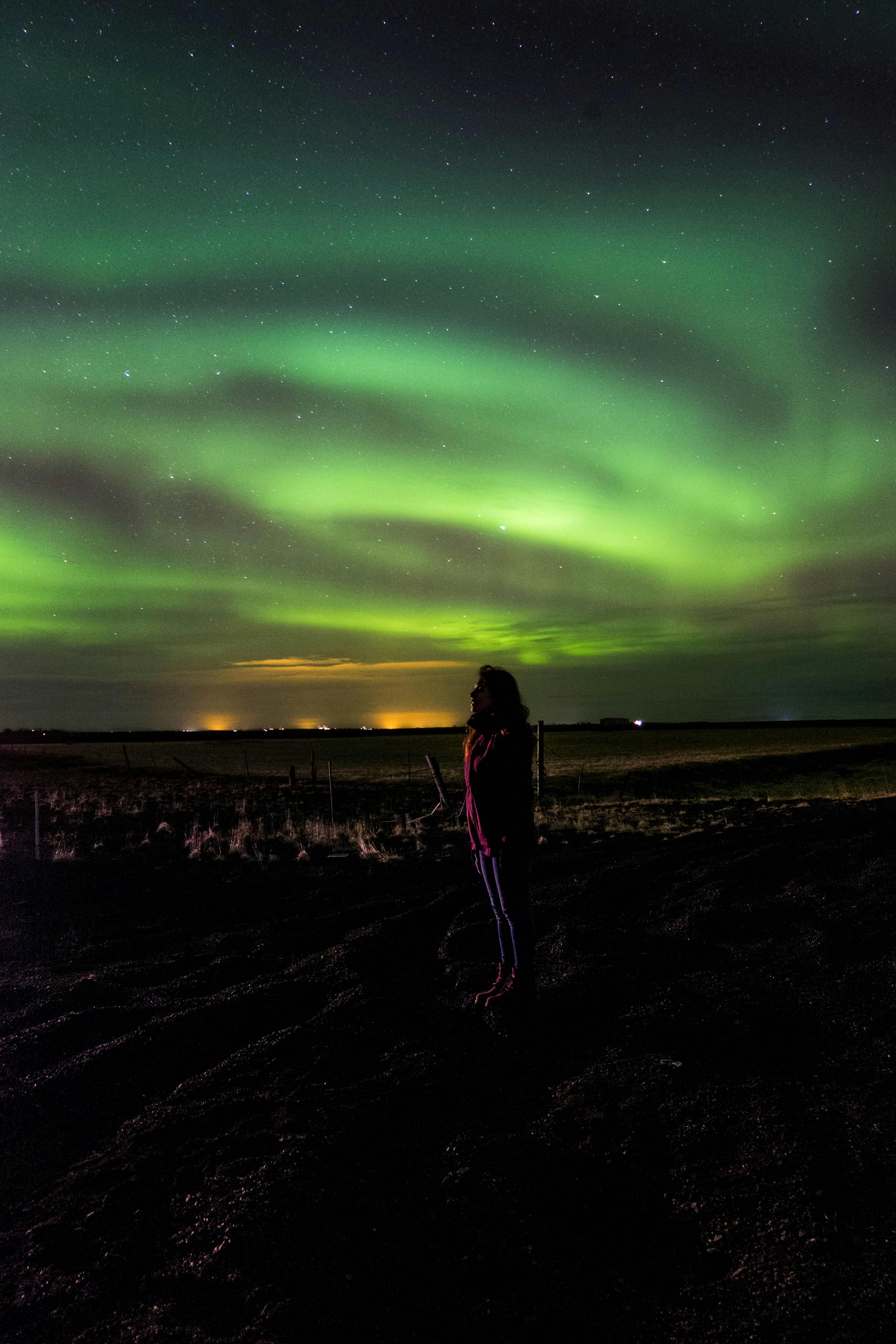 Person Looking At The Northern Lights Free Stock Photo