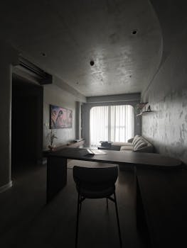 A cozy modern living room in Vietnam featuring minimalist decor and soft lighting.