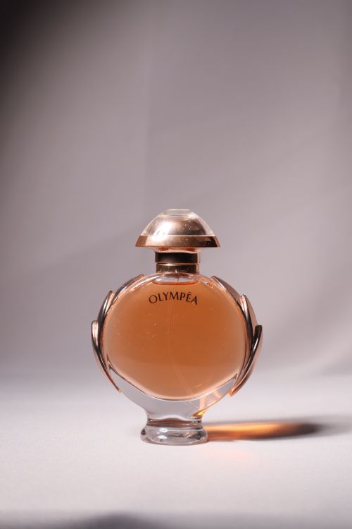 Free A sophisticated photo of an Olympea perfume bottle with elegant lighting. Stock Photo
