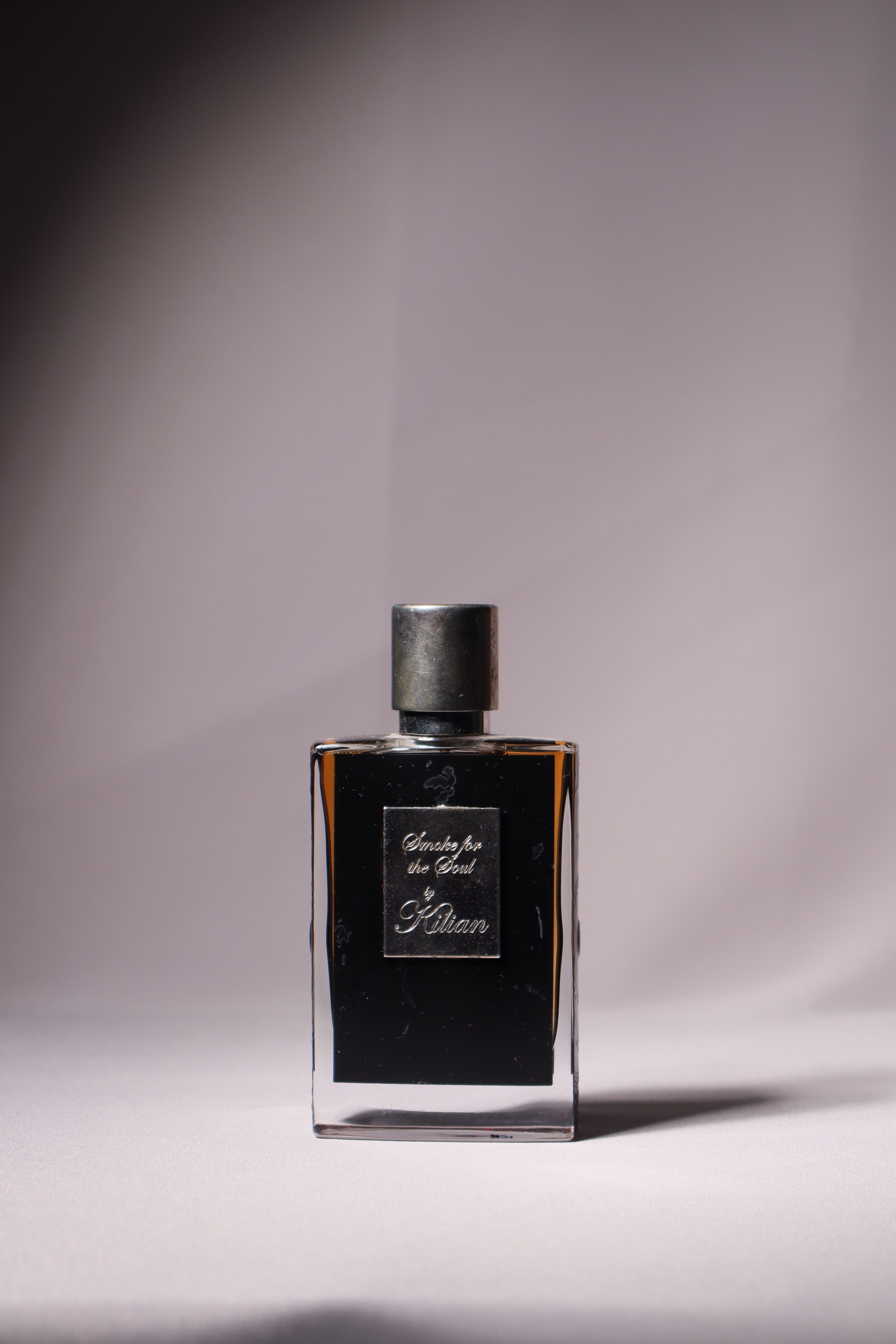 Stylish perfume bottle captured with elegance, showcasing luxury and fragrance appeal.