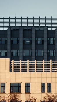 Minimalist architectural shot of a modern urban building facade with geometric lines.