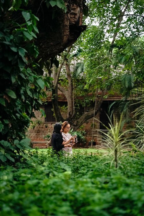 Women Enjoying Nature in a Lush Green Garden · Free Stock Photo