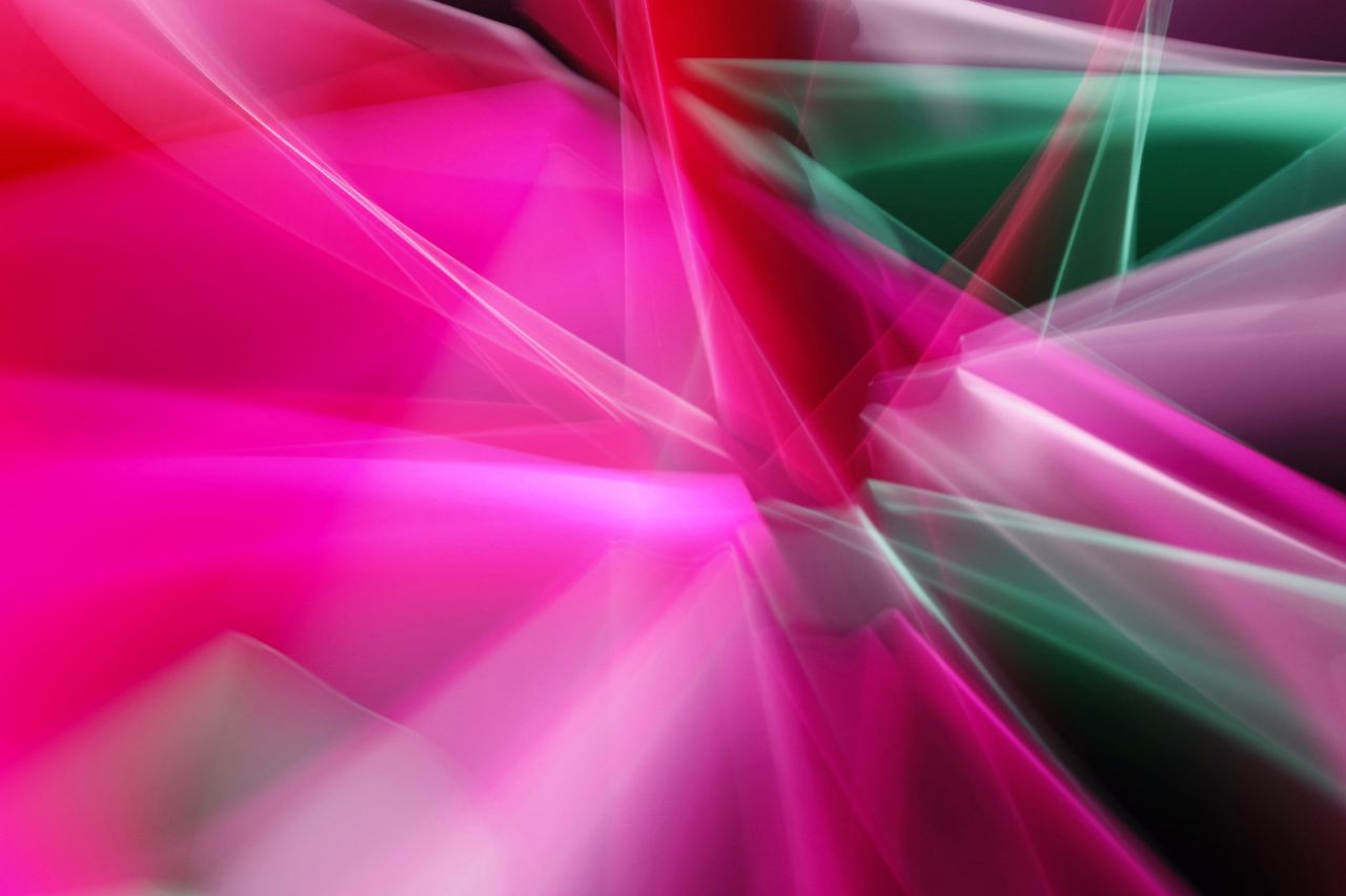 dynamic abstract light streaks in vivid pink and green hues perfect fo