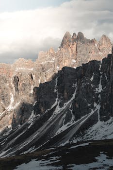 Breathtaking view of the rugged peaks of the Dolomites in sunlight, Italy.