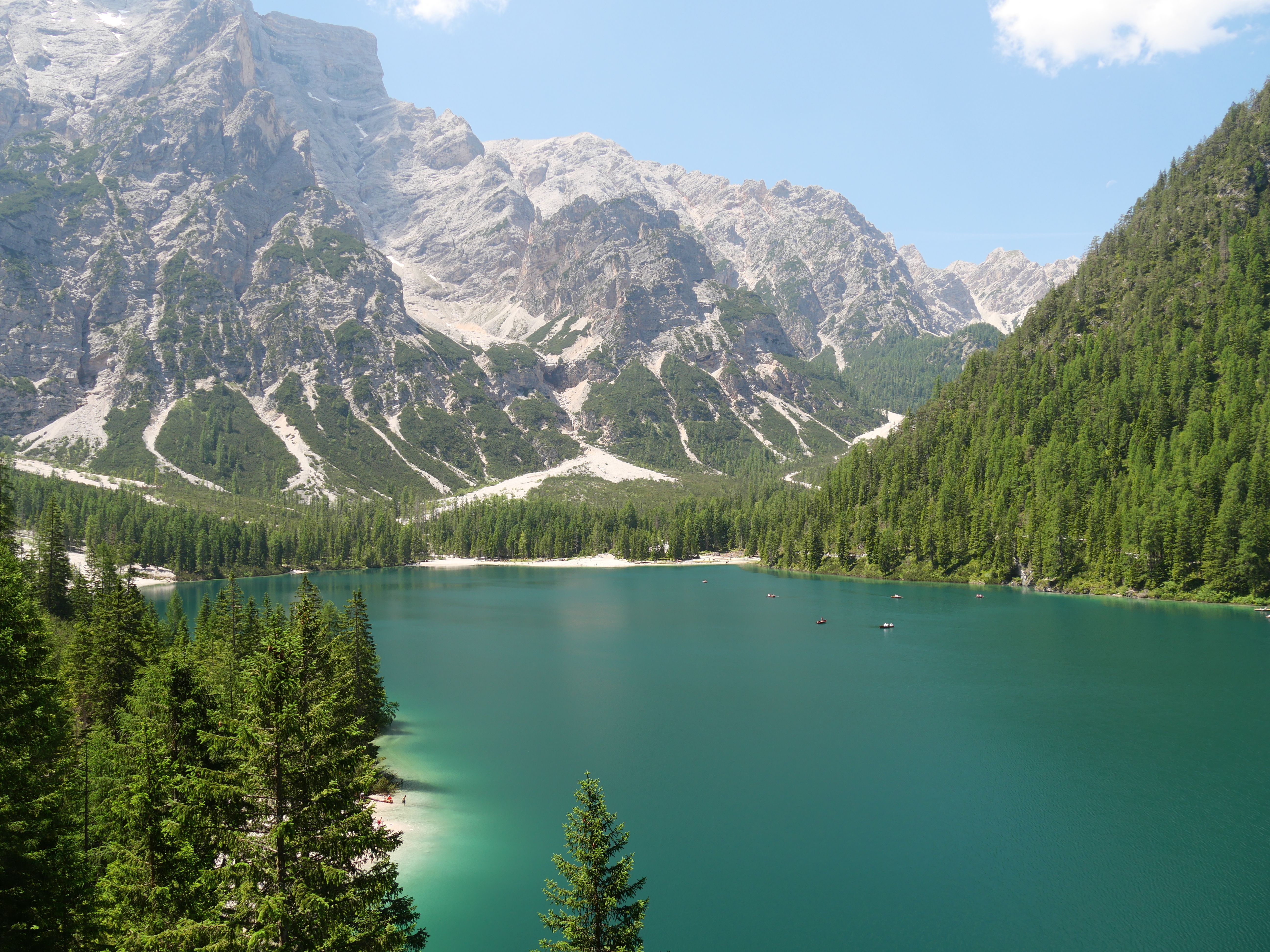 Serene lake surrounded by majestic Dolomites in Italy's South Tyrol.