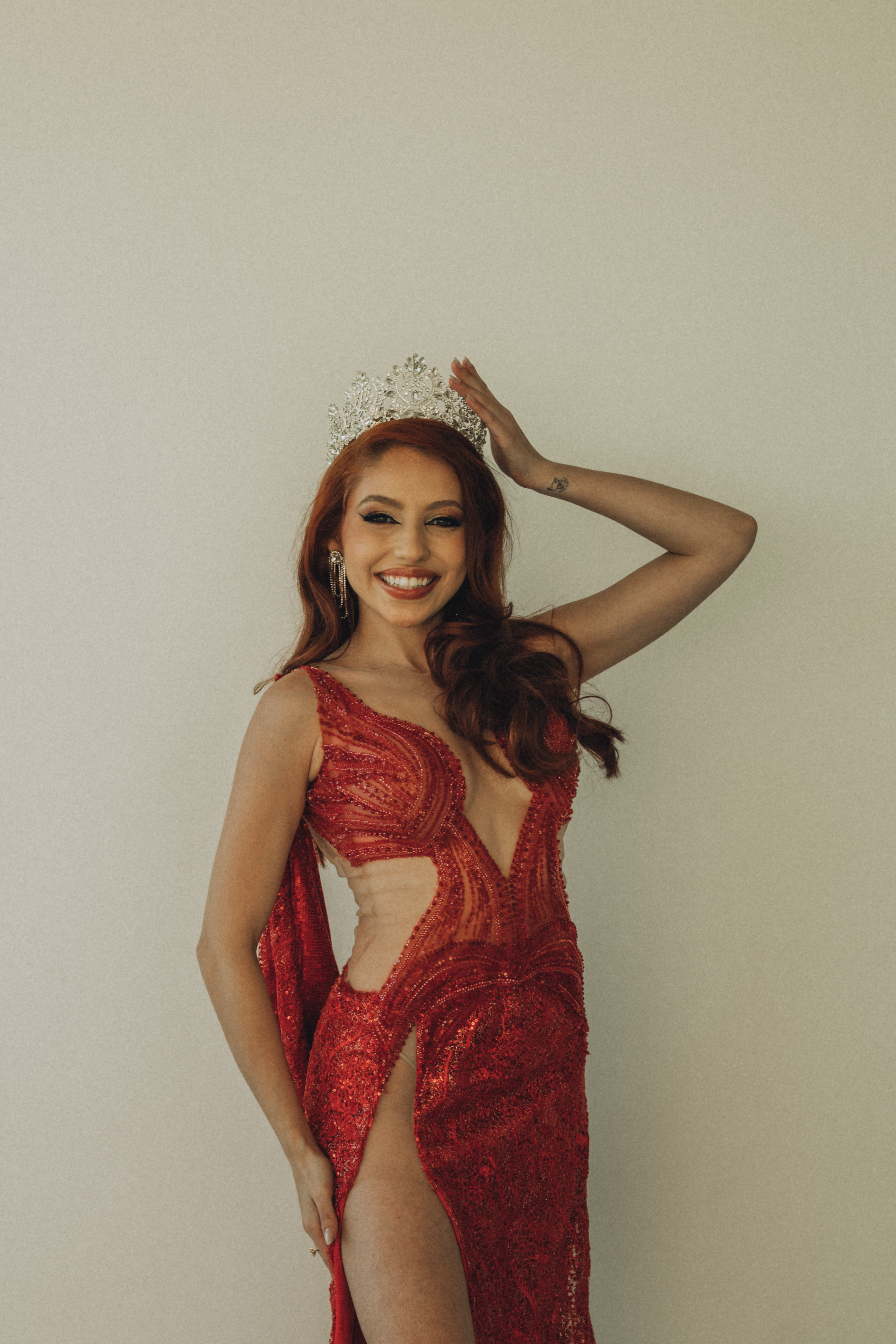 Elegant Woman in Red Evening Gown with Crown · Free Stock Photo