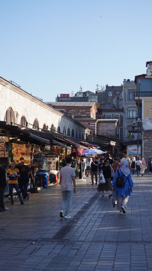 Free Explore the vibrant market street in Istanbul, teeming with locals and tourists enjoying a sunny day. Stock Photo