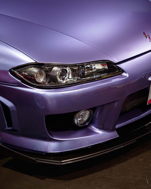 Free Detailed image of the front section of a purple car at an Anaheim auto show. Stock Photo