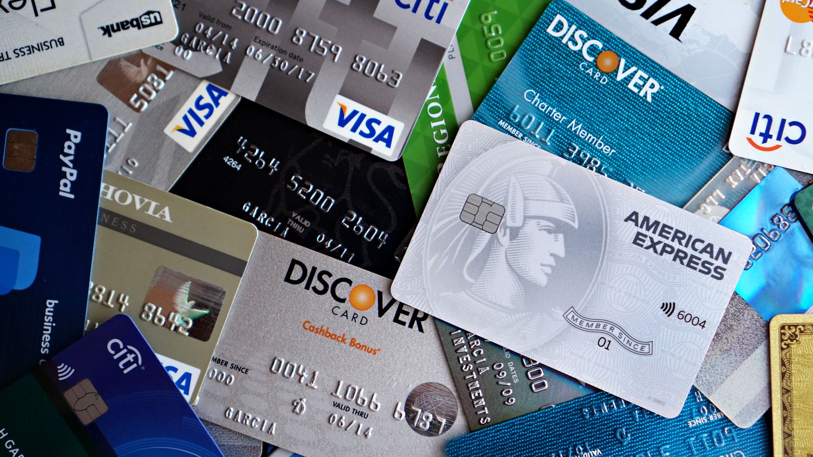 A flat lay of assorted credit and debit cards from various banks. Ideal for finance and banking concepts.