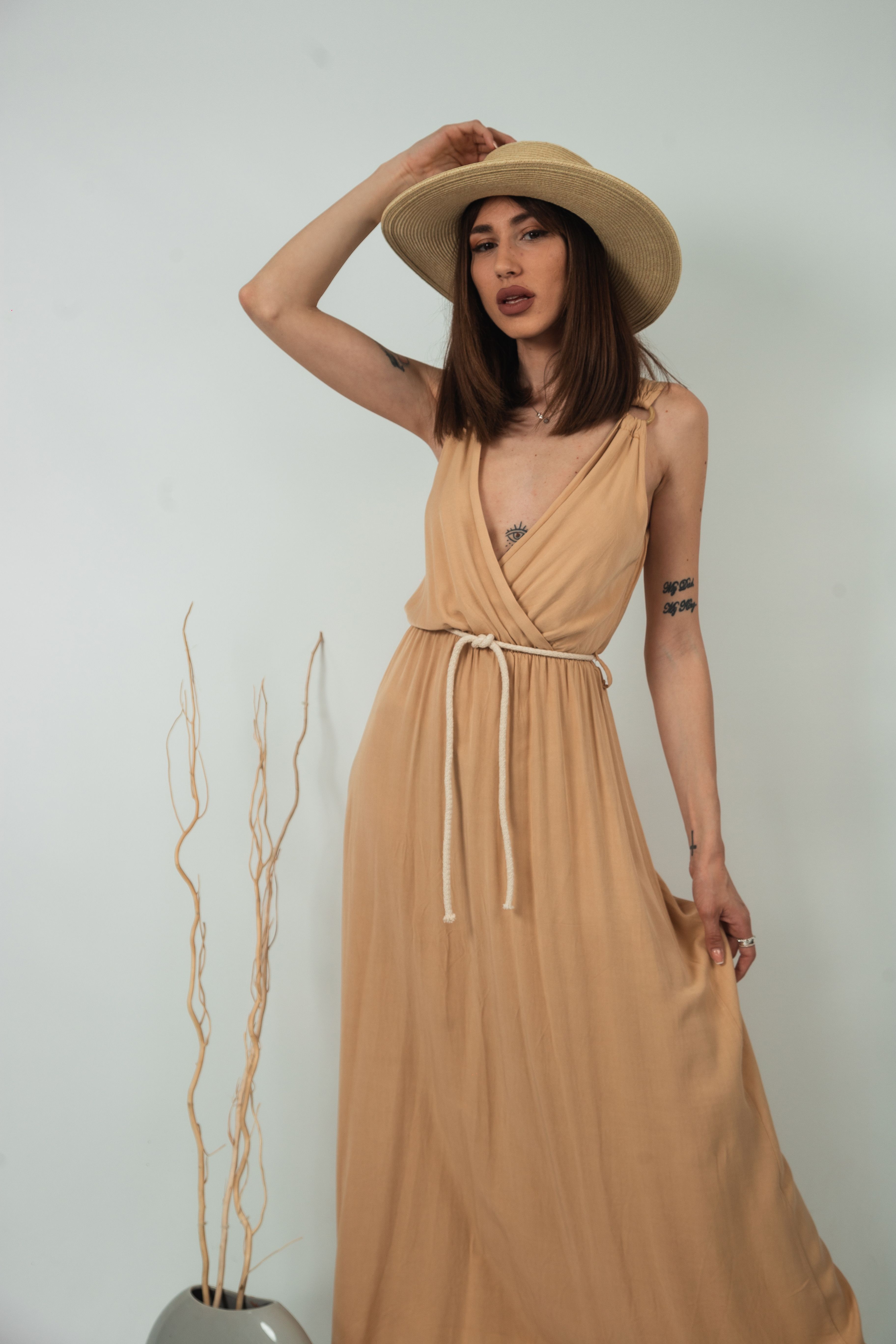 Woman in Beige Dress and Straw Hat Fashion Shoot · Free Stock Photo