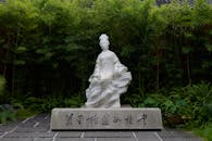 Elegant Marble Statue in Tranquil Garden Setting