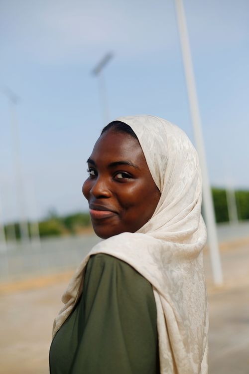 Smiling Woman in Hijab Outdoors in Abuja · Free Stock Photo