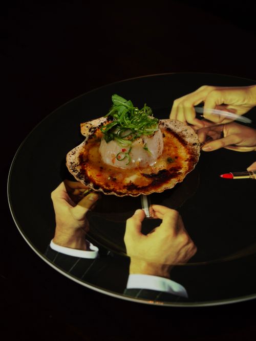 Free A sophisticated gourmet dish on reflective surface capturing culinary art, elegance, and creativity. Stock Photo