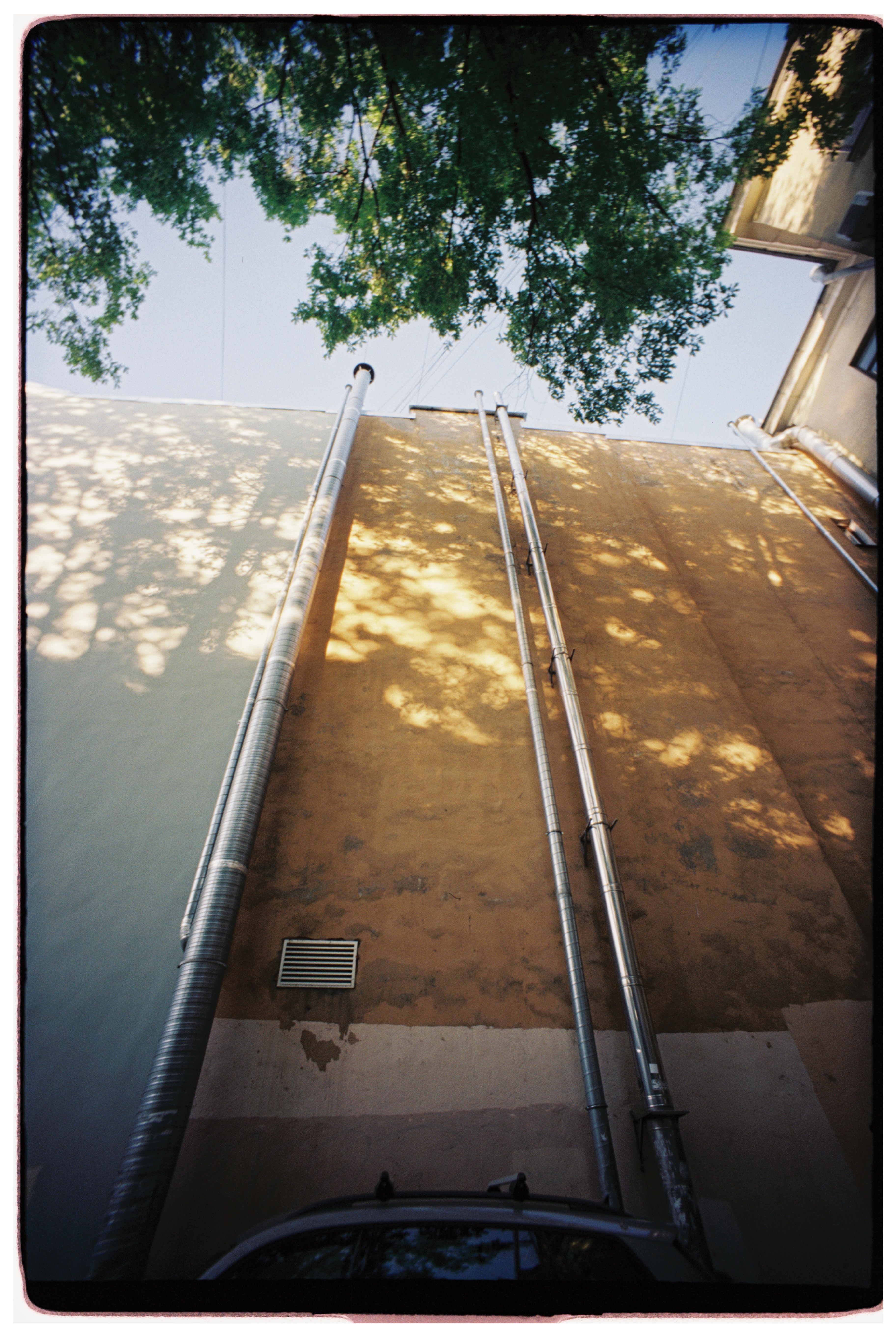 Upward View of Building with Metal Pipes · Free Stock Photo