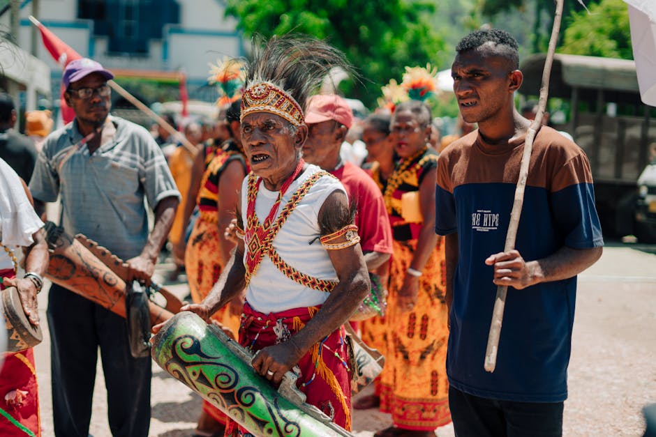 Vibrant cultural parade featuring traditional Papua costumes and instruments.