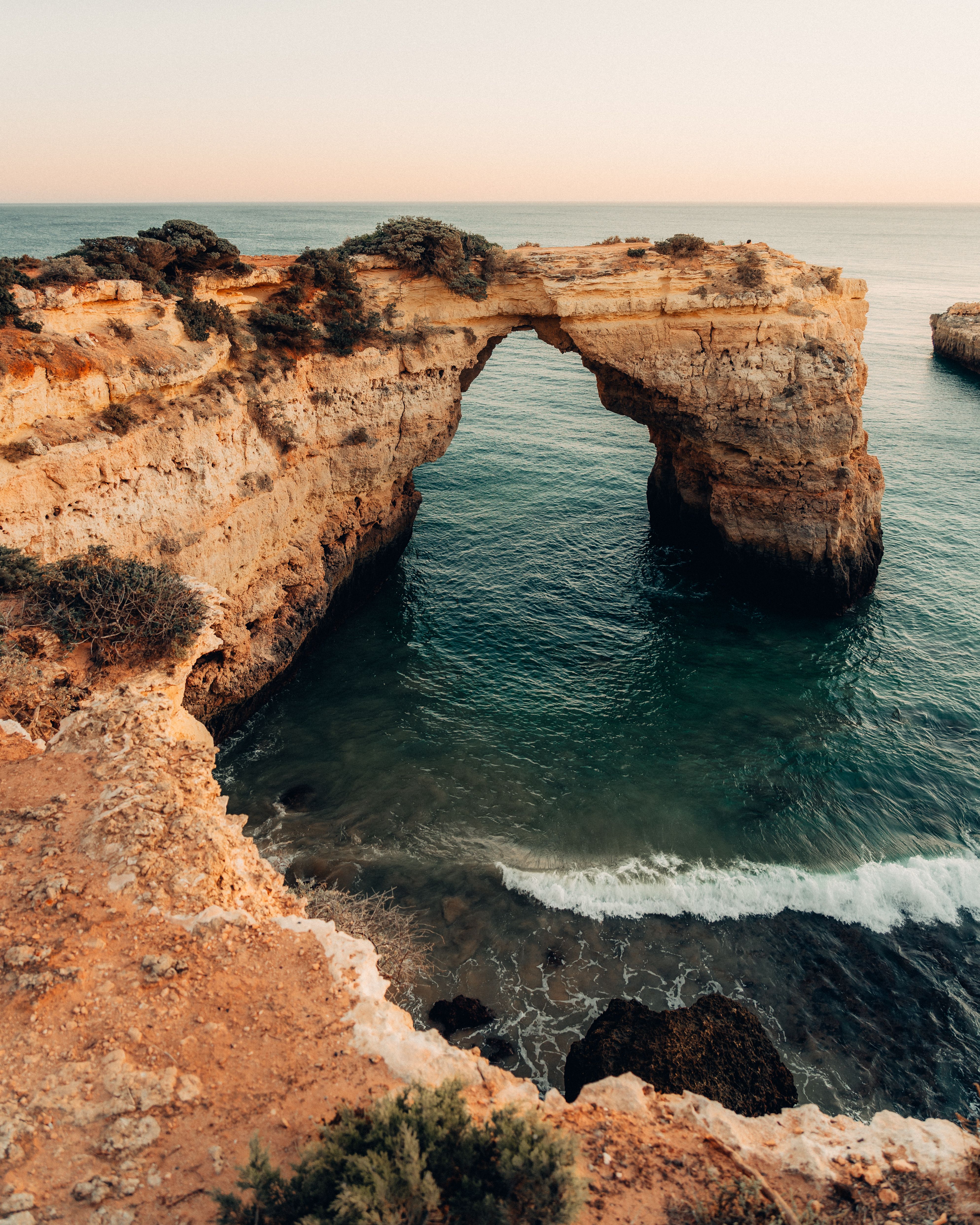 Photography of Mountain Cliff Beside Seashore