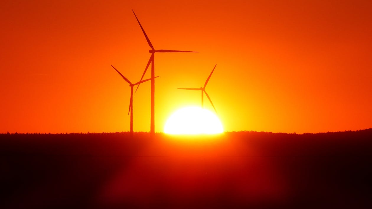 Free Silhouette of Wind Turbines at Sunset Stock Photo