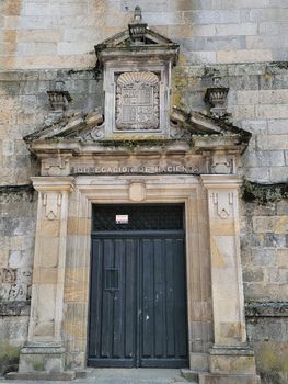 Close-up of a historic building facade in Galicia, Spain, showcasing detailed stone architecture.