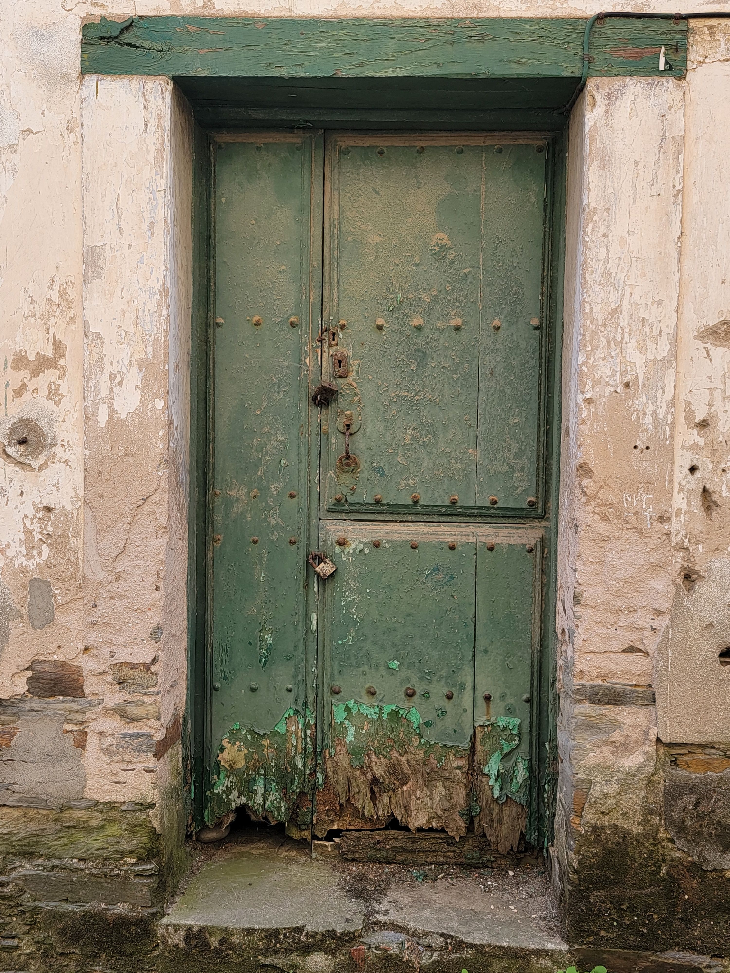 Rustic Green Wooden Door in Ancient Stone Wall · Free Stock Photo