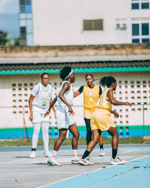 Free Outdoor women's basketball game with players in action, showcasing teamwork and competition. Stock Photo