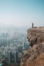 Man Standing on Cliff