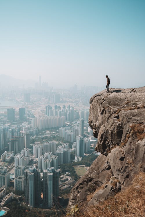 Man Standing on Cliff