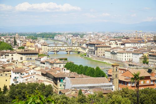 Free Breathtaking aerial view of Florence, Italy, showcasing the iconic Ponte Vecchio and surrounding architecture. Stock Photo