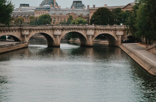 Enchanting view of a historic bridge over the Seine River in Paris, France.