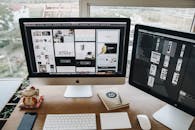 Turned-on Silver Imac and Magic Keyboard With Mouse