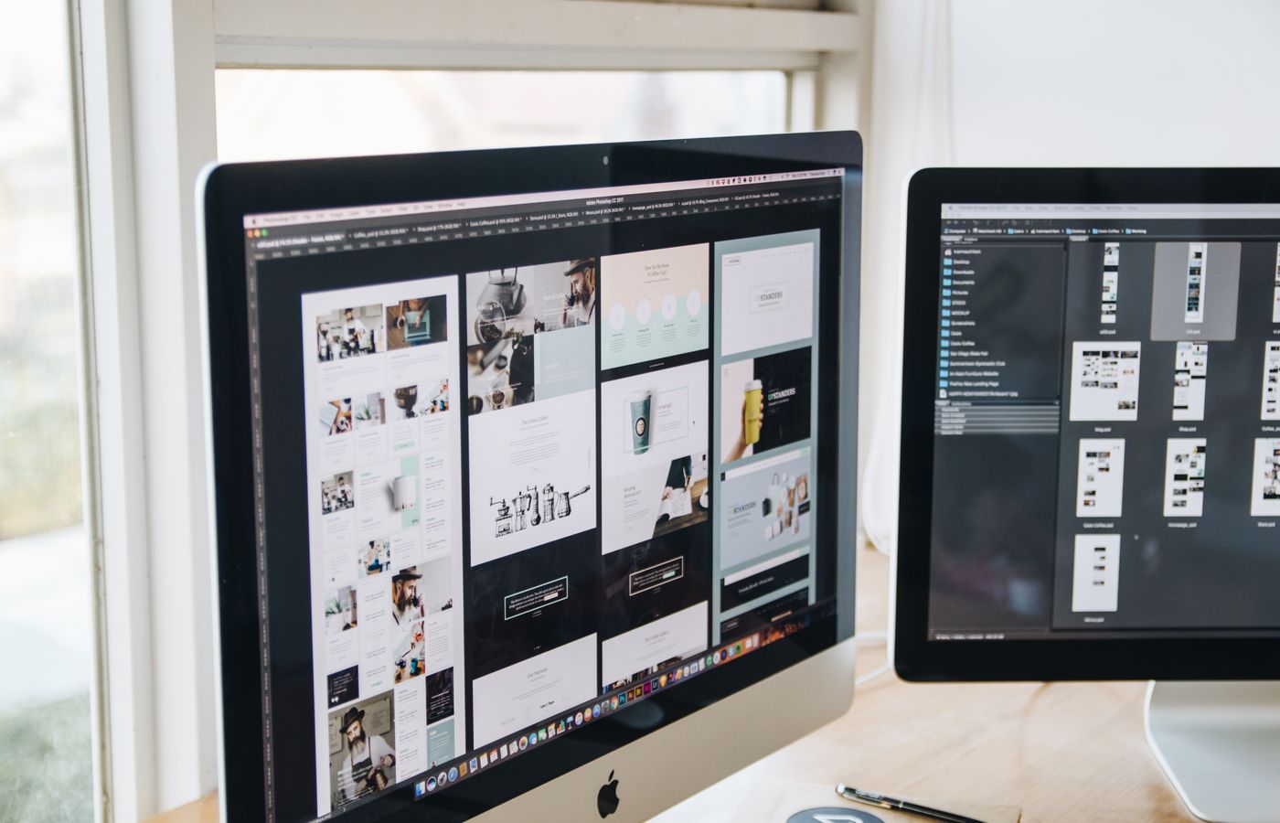 Modern office desk setup with dual monitors displaying design software, ideal for tech and business themes.