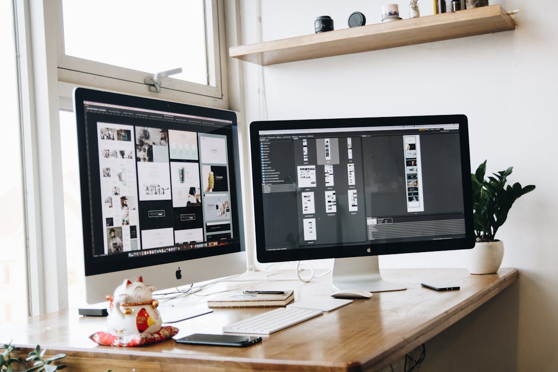 Influencer Free Turned-on Silver Imac on Desk Stock Photo