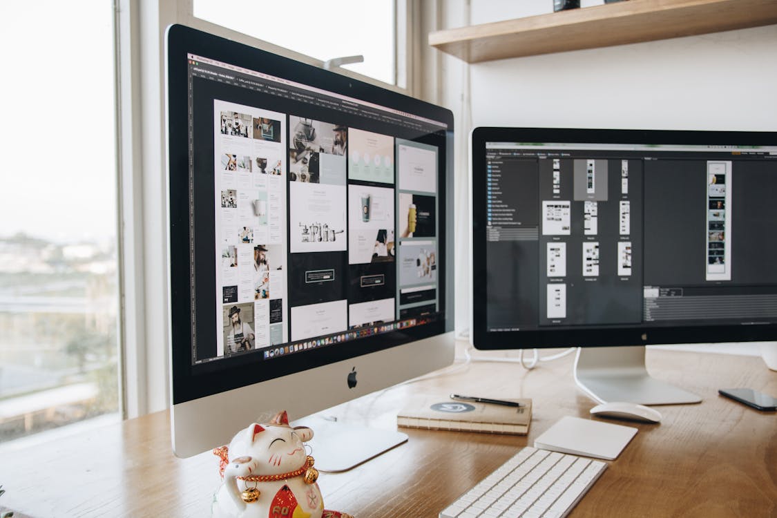 Free Two Turned-on Silver Imacs Stock Photo