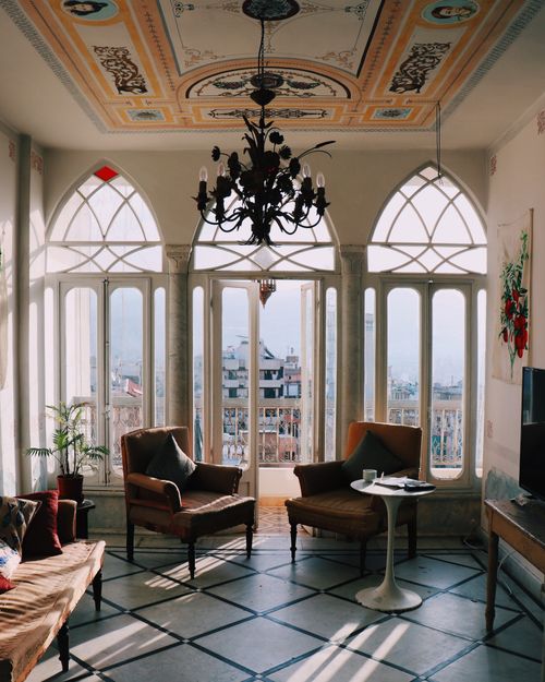 Free Sunlit vintage living room in Beirut with classic decor and a picturesque view. Stock Photo