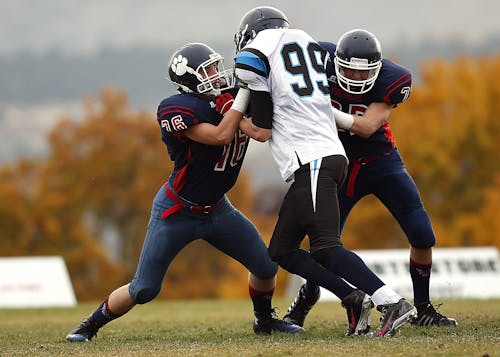 Athletes With Ball on the Background