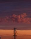 Black Metal Tower Under White Clouds and Blue Sky